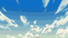 a blue sky with white clouds and a castle in the distance