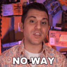 a man wearing a shirt that says no way on the front