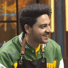 a man wearing a green jacket that says " one happy customer " on the back
