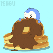 a penguin is sitting on a stack of pancakes with chocolate icing