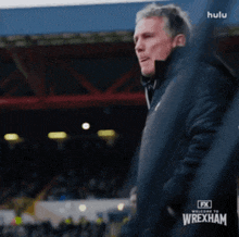 an ad for fx welcome to wrexham shows a man