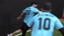 a blurry picture of two soccer players one of whom has the number 10 on his back