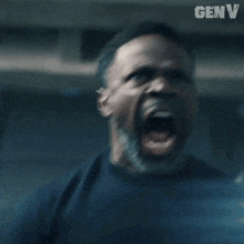 a man stands in a dark room with the word genv on the bottom right