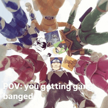 a group of power rangers are standing in a circle with the caption " you getting gang banged "