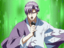 a man in a kimono is singing into a microphone in front of a green background