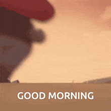 a picture of a sunset with the words good morning on the bottom