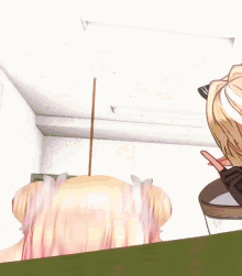 a close up of a girl 's face with a bow in her hair