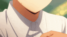 a close up of a person wearing a white shirt and a tie