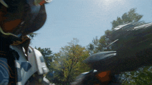 a blurry picture of a person wearing a helmet and sunglasses