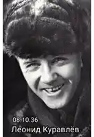 a black and white photo of a man wearing a fur hat and smiling