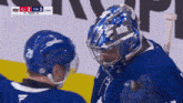 a hockey game is being played and the score is 3 to 2