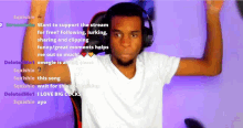 a man wearing headphones is sitting in front of a screen that says " want to support the stream for free " on it