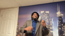 a man in a suit is dancing in front of a cityscape wallpaper