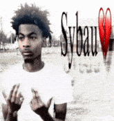 a man in a white shirt is giving the middle finger in front of a sybau logo