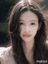 a close up of a woman 's face with shotcut ai video editor