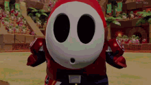 a video game character named shy guy is standing in a stadium