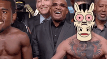 a man with a zebra mask on his face is standing in front of a group of men .