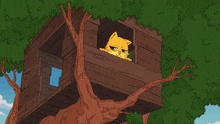 a cat is sleeping in a tree house