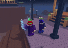 two roblox characters are standing next to each other and one of them has a hat on