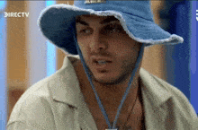 a man wearing a blue hat with the word directv on the bottom