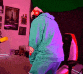 a person wearing headphones is standing in a room with a green screen behind them