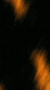 a close up of a sphere of fire with a black background .