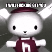 a stuffed animal with the letter h on it 's chest