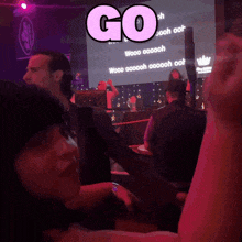 a sign that says go on it in pink letters