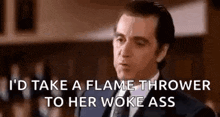 a man in a suit and tie is saying `` i 'd take a flame thrower to her woke ass `` .