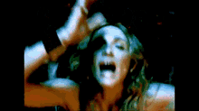 a blurry picture of a person 's hands reaching out towards another person .