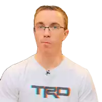 a man wearing glasses and a white shirt with trd on it