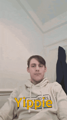 a young man wearing a hoodie that says yippie