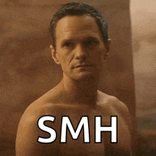 a shirtless man stands in front of a sign that says smh