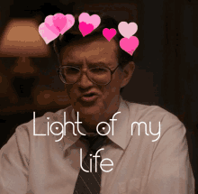 a man wearing glasses and a tie is surrounded by pink hearts and the words light of my life