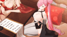 a girl with pink hair is sitting at a table with a piece of paper on it