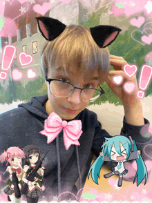 a boy with cat ears and a pink bow on his hoodie