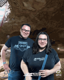 a man and a woman wearing call of duty xp shirts