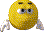 a close up of a yellow smiley face with arms and legs .