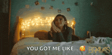 a woman is laying on a bed with the words " you got me like " above her