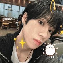 a close up of a person 's face with a sticker of a bunny and the name tina on the bottom
