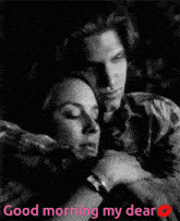 a black and white photo of a man and woman hugging with the words " good morning my dear "
