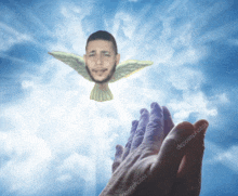 a hand is reaching out towards a dove with a man 's head on it