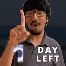 a man wearing glasses and a shirt that says day left is giving a thumbs up