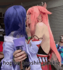 two women in cosplay are kissing each other with the words `` hop on genshin pookie '' written on the bottom .