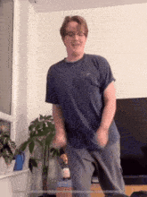 a man in a blue nike shirt is dancing