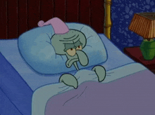 squidward from spongebob squarepants is laying in bed wearing a nightcap and a hat .