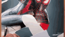a person is drawing a picture of a spiderman with a pencil