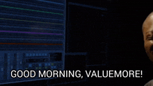 a man says good morning valuemore in front of a computer screen
