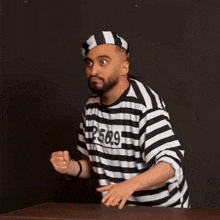 a man in a striped shirt with 235629 on it