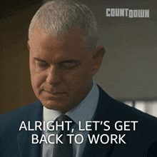 a man in a suit and tie is saying alright let 's get back to work